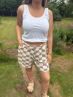 Cream shell print shorts