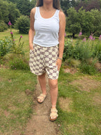 Cream shell print shorts